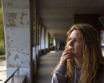 Close-up of thoughtful woman in corridor