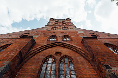Low angle view of st. peter church against sky in lubeck, germany.