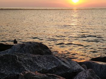 Scenic view of sea against sky during sunset