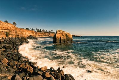 Scenic view of sea against clear blue sky