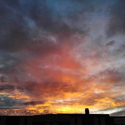 Low angle view of cloudy sky at sunset