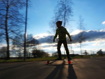 Full length of people walking on road