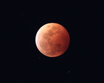 Low angle view of moon against clear sky at night