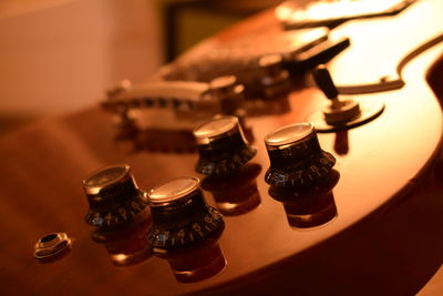 Close-up of knobs on guitar