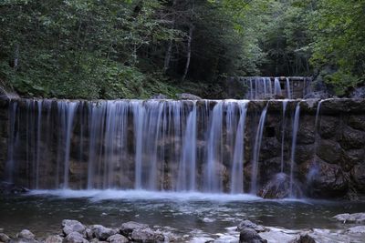 View of waterfall in forest