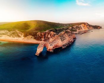 High angle view of sea shore against sky