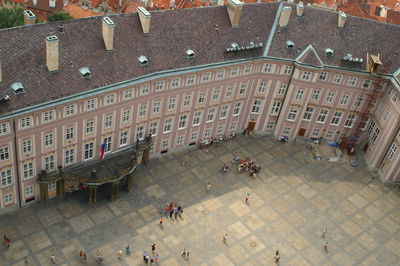 High angle view of people on street against buildings in city