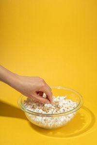 Midsection of woman holding ice cream