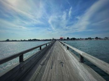 Pier over sea against sky