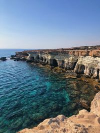 Scenic view of sea against clear blue sky