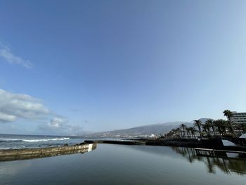 Scenic view of sea against blue sky