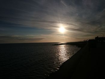 Scenic view of sea against sky at sunset