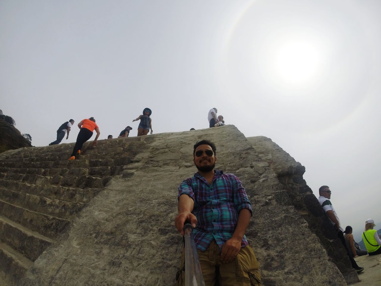 lifestyles, leisure activity, casual clothing, person, young adult, togetherness, young men, full length, bonding, looking at camera, portrait, clear sky, happiness, tourist, sunlight, standing, smiling