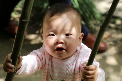 Portrait of cute baby boy in playground