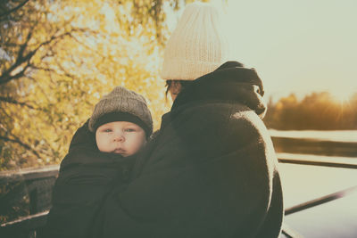 Portrait of mother and daughter during winter