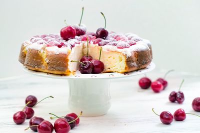 Close-up of fruits with flowers in plate