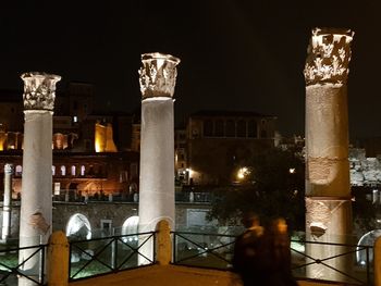 Illuminated buildings in city at night