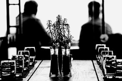 Rear view of man sitting on table at restaurant