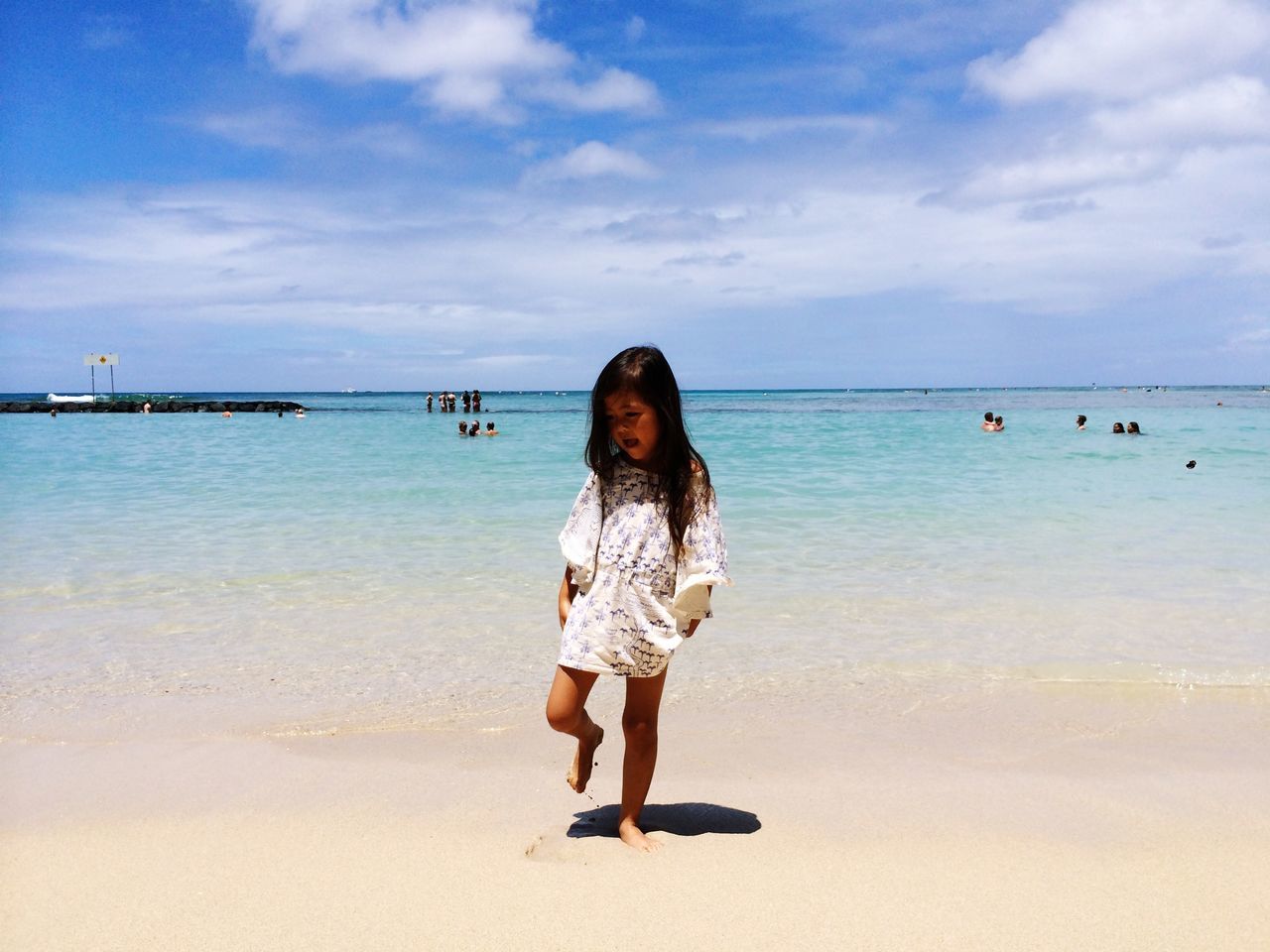 sea, water, beach, sky, lifestyles, full length, leisure activity, horizon over water, casual clothing, shore, vacations, standing, rear view, sand, person, cloud - sky, beauty in nature, tranquility