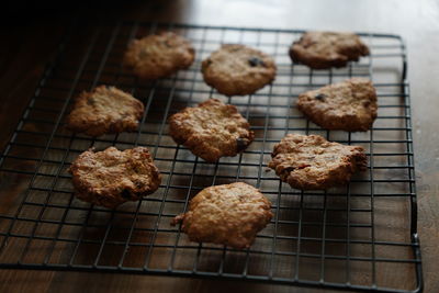 There are some delicious and healthy cranberry oatmeal cookies just baked on the table