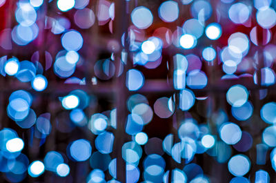 Defocused image of illuminated lights at night