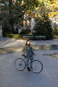 Portrait of a young woman in an urban park