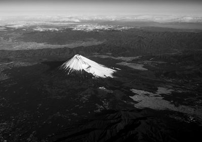 Airplane view of mount fuji in black and white.