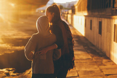 Rear view of couple standing outdoors