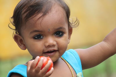 Close-up portrait of cute girl smiling