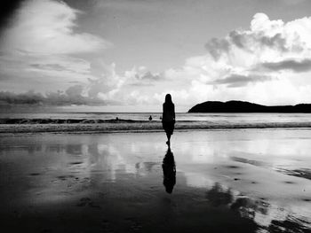 People standing on beach