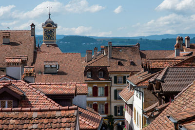 Houses in city against sky