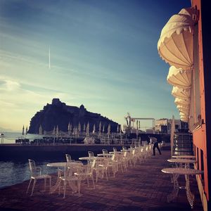 View of restaurant by buildings against sky