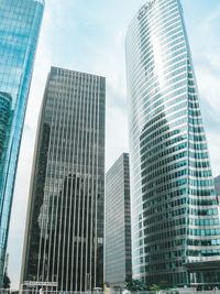 Low angle view of modern buildings against sky in city