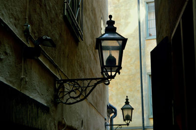 Low angle view of lantern on wall