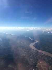 Aerial view of sea and landscape against sky