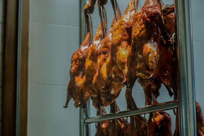 Close-up of duck meat on barbecue grill