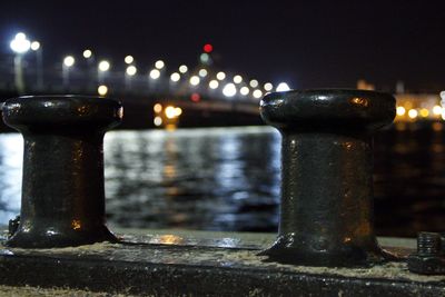 Close-up of illuminated railing at night