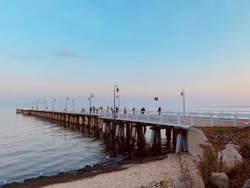 Pier on sea against sky