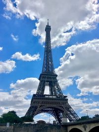 Low angle view of tower against cloudy sky