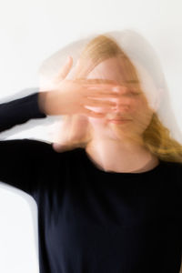 Portrait of woman against white background