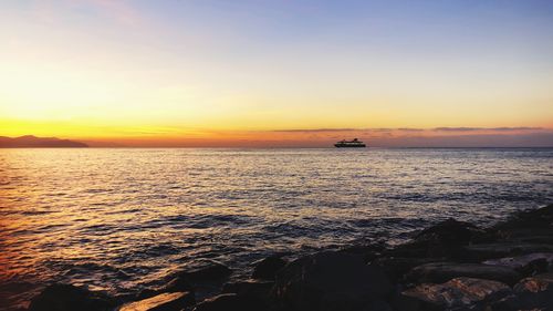 Scenic view of sea against sky during sunset