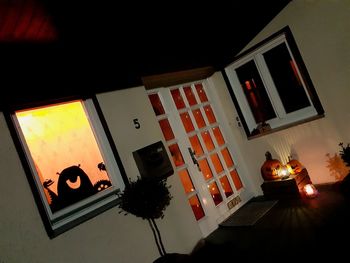 Low angle view of illuminated house at home