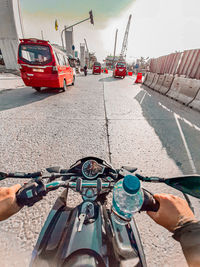 Man riding bicycle on road in city