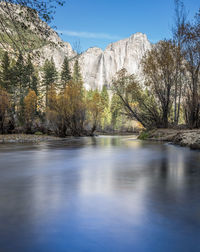 Scenic view of merced river against mountains