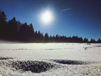 Scenic view of landscape against clear sky during winter