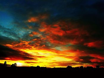 Scenic view of dramatic sky over landscape