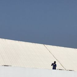 Low angle view of man working on terrace