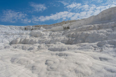 Scenic view of arid landscape against sky