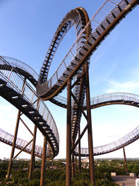 Low angle view of ferris wheel against sky