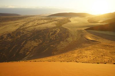 High angle view of desert landscape at sunset